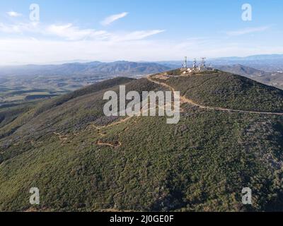 Telecommunication antennas on the top of a mountain. Stock Photo