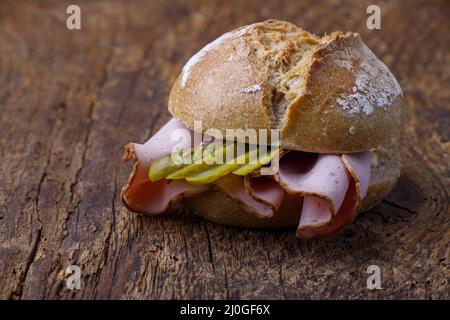 Bavarian liver cheese roll on wood Stock Photo
