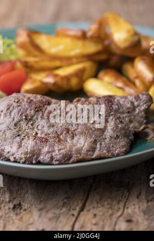 Grilled steaks with french fries Stock Photo