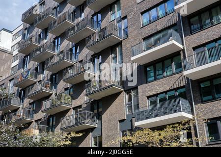 Modern gray apartment building with many balconies seen in Berlin ...