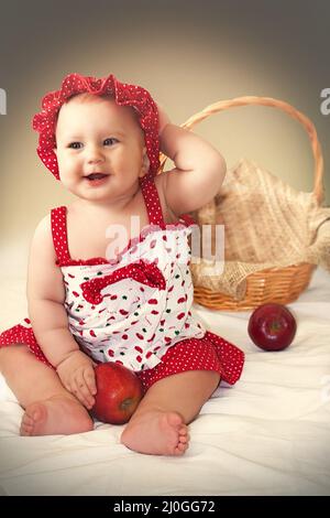 Little cute girl in red dress Stock Photo
