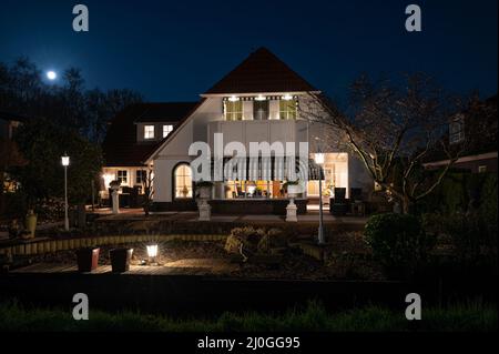 Scenic villa in the evening with rising moon. Stock Photo