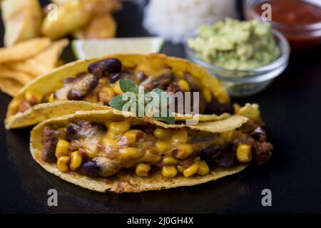 Mexican tacos with rice on slate Stock Photo