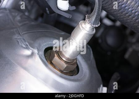 Lambda probe on a modern internal combustion engine Stock Photo