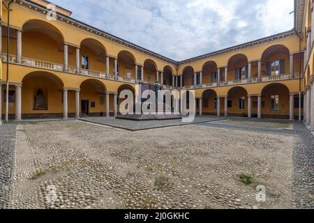 Pavia, Italy - March 12, 2022: street view inside the cloister of Pavia University, no people are visible. Stock Photo