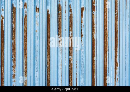 Metal rusty texture. Corrugated metal fence background. Stock Photo
