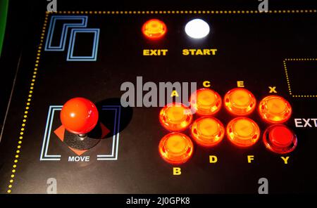 Gamepad with joystick and many colorful buttons. Retro arcade old video game stick control Stock Photo