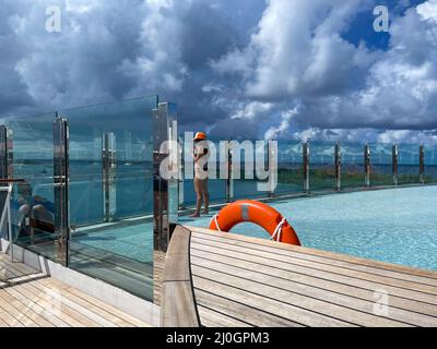 Orlando, FL USA - October 11, 2021:  The quiet adult swimming pool area on the MSC Cruise Ship Divina in Port Canaveral, Florida., Stock Photo