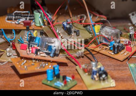 Electrical components on circuit board - LED, resistor, capacitor Stock Photo