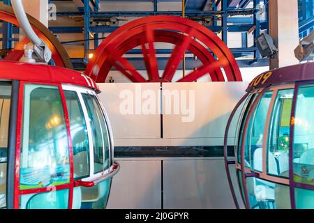 The sunny view of cable car and theme park near to ocean Stock Photo