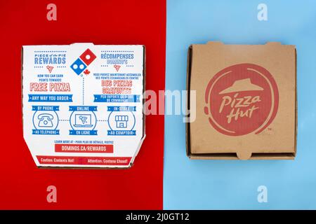 Calgary, Alberta. Canada. May 17, 2021. A Domino's and Pizza Hut Pizza Boxes. Concept: Top Pizza Companies Stock Photo
