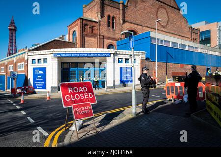 Blackpool, UK. 19th Mar, 2022. Police stand guard outside the Winter Gardens where this years Spring Tory Party Conference is being held. Locals and Unions join in unity to make sure the MP's hear that they are not wanted in one of the most deprived towns in the country. This comes after the cost of living crisis is set to make this year one of the most difficult in decades. Credit: Andy Barton/Alamy Live News Stock Photo
