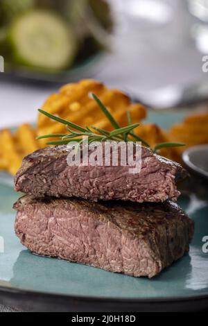 Grilled steak with fresh potato grids Stock Photo - Alamy