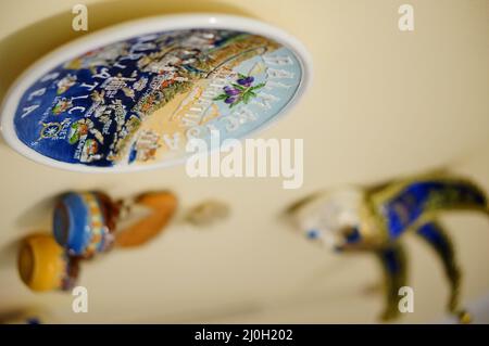 Close-up shot of a Croatian plate-shaped decoration hanging on a wall. Stock Photo