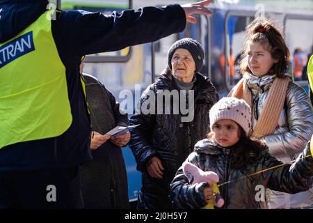 Przemysl, Poland. 19th Mar, 2022. Civilians, fleeing from Ukraine due to ongoing Russian attacks, continue to enter through the Medyka border crossing in Przemysl, Poland on March 15, 2022. Stressed and confused as to which train to take. Photo by Emilie Madi/ABACAPRESS.COM Credit: Abaca Press/Alamy Live News Stock Photo