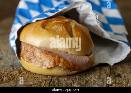 Bavarian liver cheese sandwich on dark wood Stock Photo