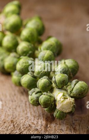 Brussels sprouts on dark wood Stock Photo