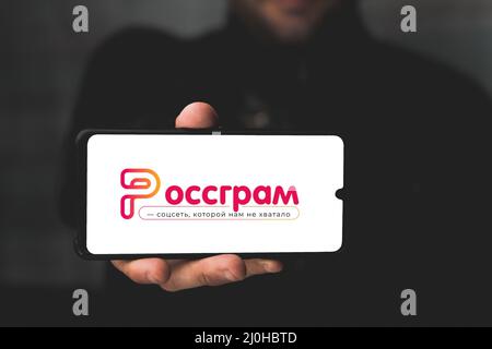 Russia, MOLDOVA - 19 Mar, 2022: Holding a phone with the icon social network of the Russian Instagram app 'Rossgram'  Stock Photo