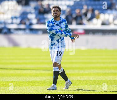 Huddersfield, UK. 19th Mar, 2022. Duane Holmes #19 of Huddersfield Town warming up before the game in Huddersfield, United Kingdom on 3/19/2022. (Photo by Simon Whitehead/News Images/Sipa USA) Credit: Sipa USA/Alamy Live News Stock Photo