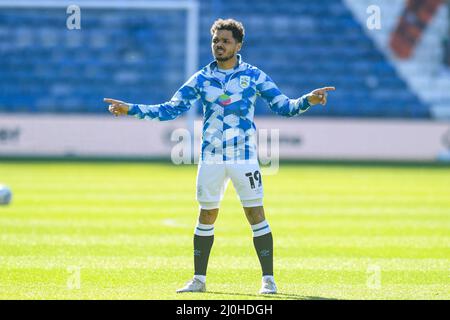 Huddersfield, UK. 19th Mar, 2022. Duane Holmes #19 of Huddersfield Town warming up before the game in Huddersfield, United Kingdom on 3/19/2022. (Photo by Simon Whitehead/News Images/Sipa USA) Credit: Sipa USA/Alamy Live News Stock Photo