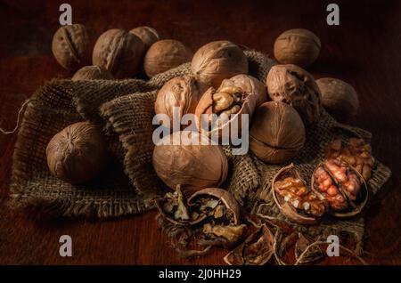 Walnuts on a dark background in a rustic style Stock Photo