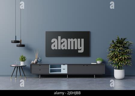 LED TV on the dark blue wall in living room,minimal design.3d rendering Stock Photo