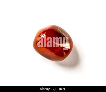 Carnelian agate gemstone on a white background Stock Photo