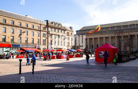 Dundee, Tayside, Scotland, UK. 19th Mar, 2022. Temperatures in parts of North East Scotland reached 15°C as a result of the warm March sunshine. Local residents are out and about in Dundee's city centre, taking advantage of the warm weather while shopping at the Dundee Farmers Market in the city Square. Credit: Dundee Photographics/Alamy Live News Stock Photo