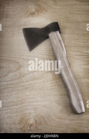 An axe with a wooden axe handle Stock Photo