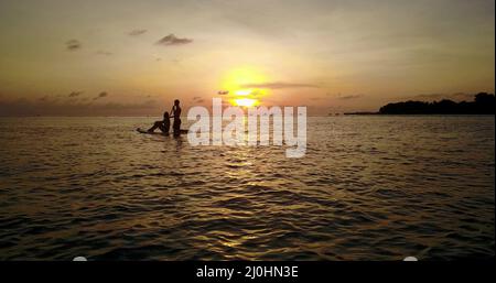 Cute happy young couple spending their vacation on Rasdhoo island in the Maldives Stock Photo
