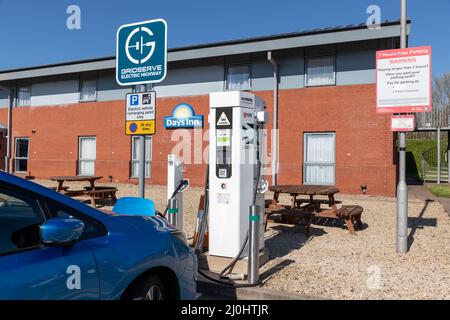 Telford, UK - 19th March 2022: Electric vehicle charging on the Gridserrve Electric Highway charging point at the Welcome Break Services on the M54 ne Stock Photo
