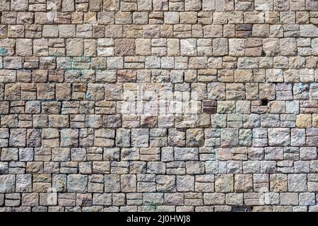 Background from a beautiful natural old stone wall Stock Photo