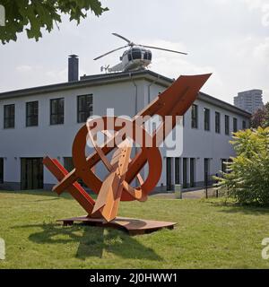 Artwork by Mark di Suvero in front and the helicopter by Michael Sailstorfer, sculpture park Cologne Stock Photo