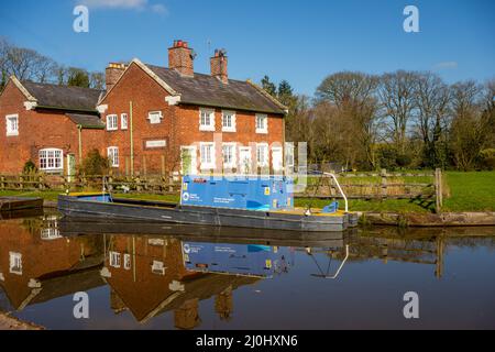 Canal and riverboat trust maintenance narrow boat moored  at Tyrley locks  on the Shropshire union canal near Market Drayton Shropshire England Stock Photo