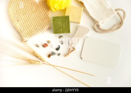 Personal bathing objects isolated on white background. Bathing fibers, soaps. Overhead photo. Stock Photo