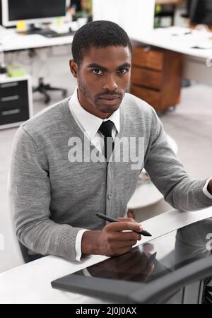 Smart technology makes everything easier. A young man working on a large touchscreen. Stock Photo