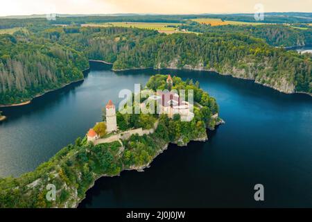Panoramic view of Zvikov Castle on the hill with trees surrounded by river Vltava and Otava in South Bohemia region in Czech Republic. Pine or spruce forest on the background  Stock Photo