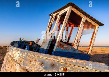 DUNGENESS, KENT. UK - DECEMBER 17 :  Derelict Fishing Boat on Dungeness Beach in Kent on December 17, 2008 Stock Photo