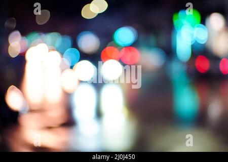 Colorful defocused background of car headlights on the street Stock Photo