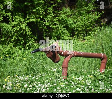 Home made roping steer has seen a lot of practice.  Body is constructed out of pvc pipe painted brown. Stock Photo