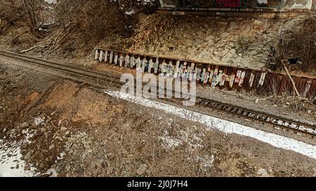 People have left their marks on this old railroad track along the river Stock Photo