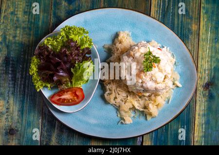 Austrian bread dumpling on sauerkraut Stock Photo