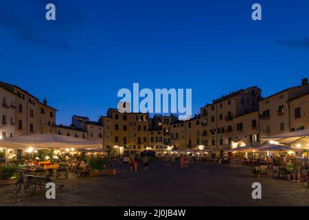 Beautiful view of Piazza dell'Anfiteatro square at twilight, Lucca, Tuscany, Italy Stock Photo