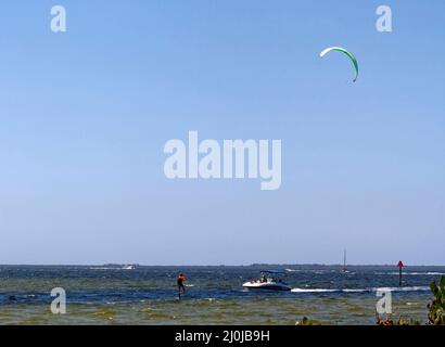 water activity, scene, boats, kiteboarder, recreation, leisure, fun, expansive blue sky, Charlotte Harbor, Florida, Punta Gorda, FL Stock Photo