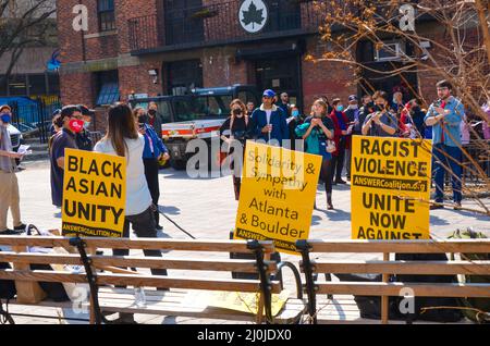 Community members gathered in Manhattan's Chinatown to demand justice for violence against women on the one year anniversary of Altanta shooting. Stock Photo
