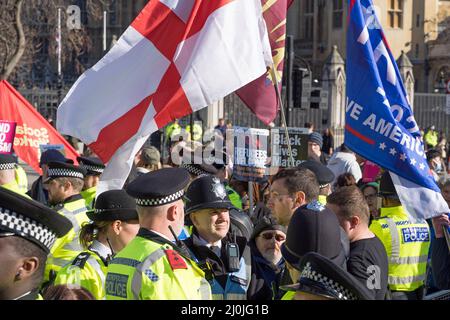 A few far right protestors surrounded by police at a anti Racism protest in Parliament Square. London - 19th March 2022 Stock Photo