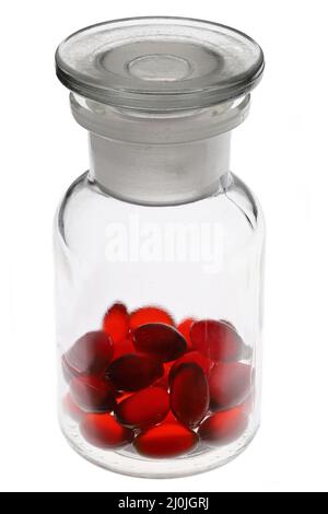 krill oil capsules in pharmacy glass bottle isolated on white background Stock Photo