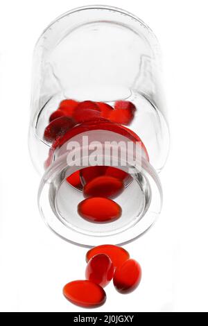 krill oil capsules in pharmacy glass bottle isolated on white background Stock Photo