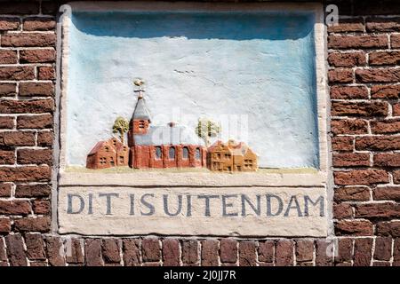 Monnickendam, The Netherlands - July 19, 2021: Wall sculpture of Uitendam in ancient center of Monnickendam North Holland in The Netherlands Stock Photo
