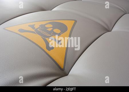 Upholstery close up with poison symbol. Stock Photo